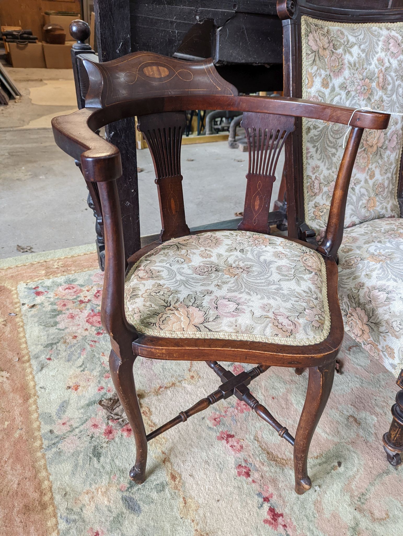 A late Victorian upholstered nursing chair and an Edwardian inlaid mahogany corner elbow chair